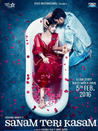 a man and woman lying in a bathtub with petals